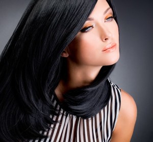 Beautiful brunette woman with long black straight hair